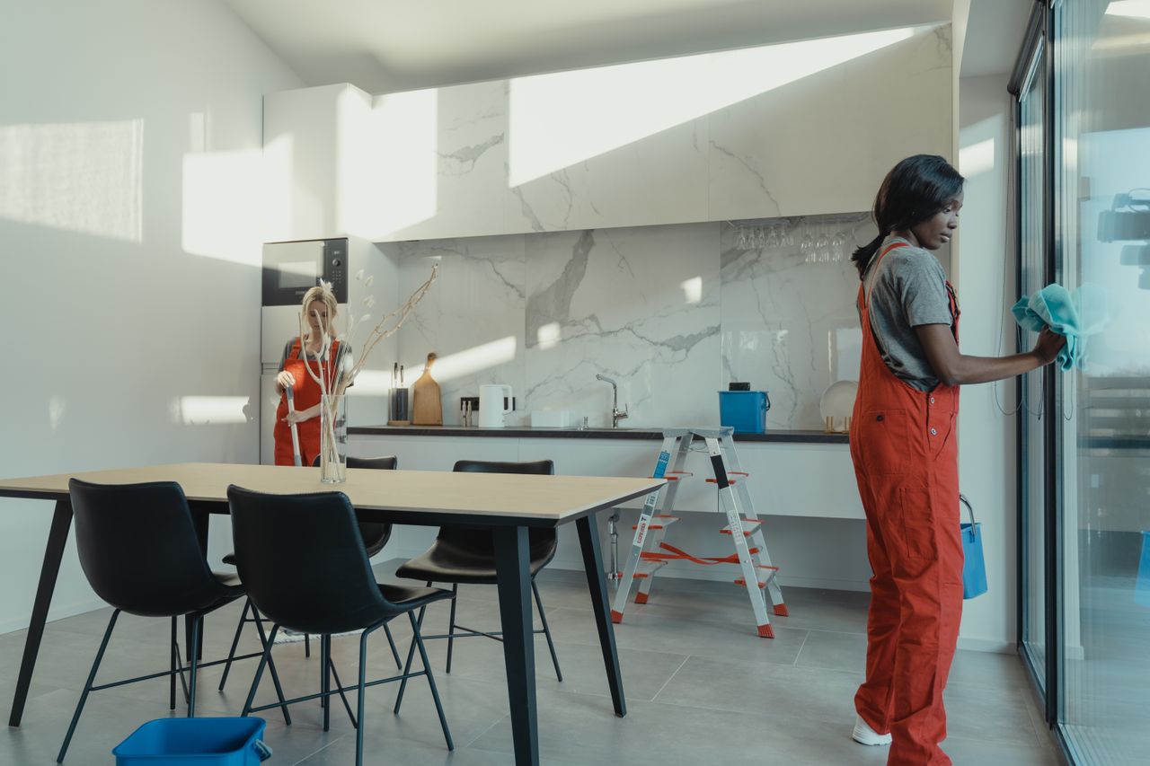 Two Scent and Fresh cleaners at work in a bright modern kitchen